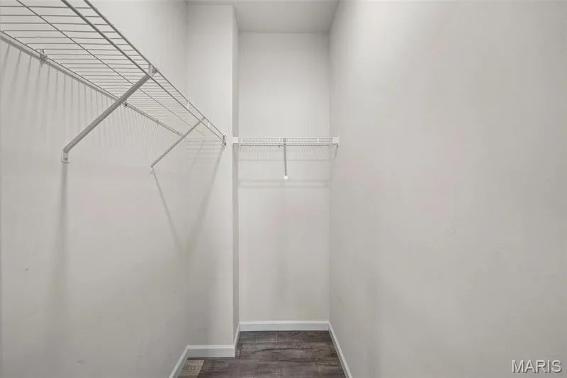 Deep primary walk-in closet — 213 Charlestowne Place Drive, St Charles, MO 63301
