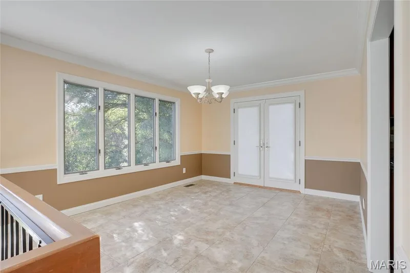 Expansive tile flooring, chandelier lighting, and a large bay window — 2508 Peppermill Lake Court, Chesterfield, MO 63005