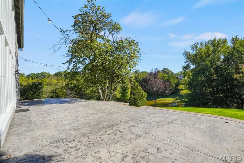 Backyard sanctuary, stamped patio with view of pond — 2508 Peppermill Lake Court, Chesterfield, MO 63005