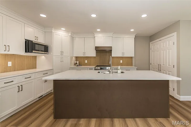 Huge island is the centerpiece of this kitchen — 2477 Baxton Way, Chesterfield, MO 63017