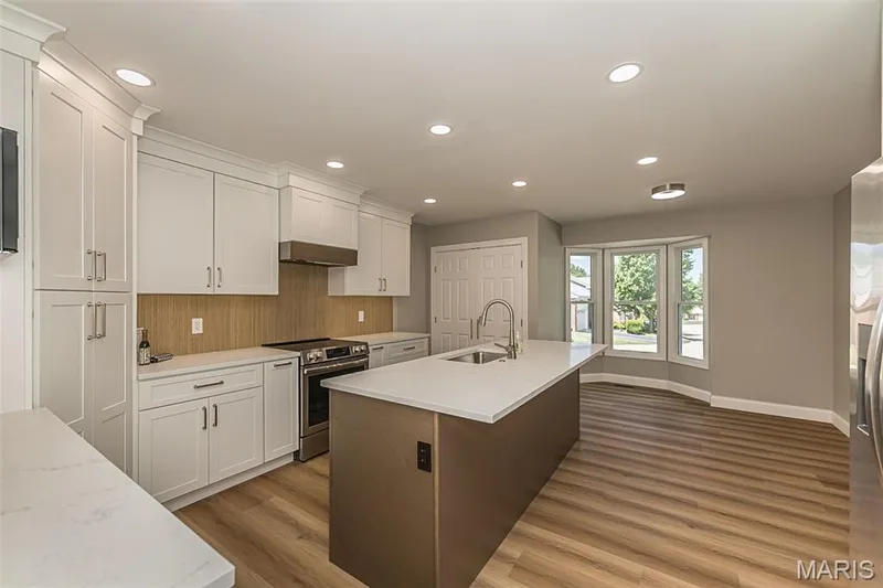 Breakfast area by the bay window and laundry closet complete this kitchen — 2477 Baxton Way, Chesterfield, MO 63017