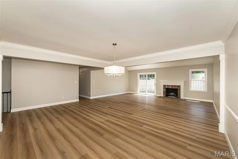 LR open to DR with gas fireplace and slider to the patio outside — 2477 Baxton Way, Chesterfield, MO 63017
