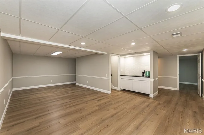 Come downstairs into the LL and find a dry bar and cozy living space — 2477 Baxton Way, Chesterfield, MO 63017
