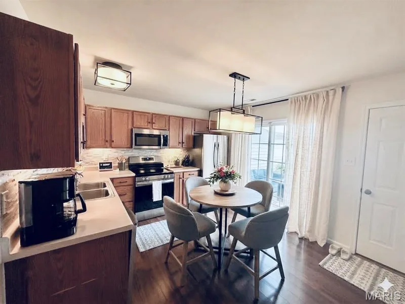 AI Generated showing potential table and chairs. — 410 Montclair Tower Drive, St Charles, MO 63303