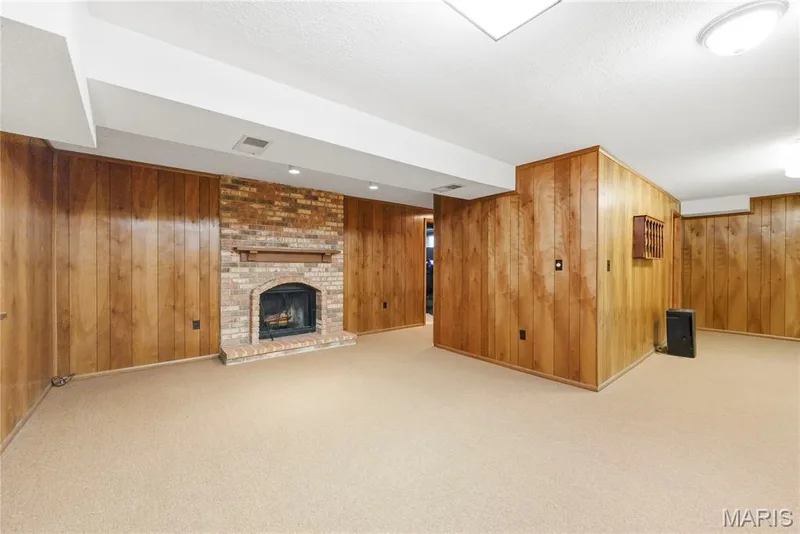 Wood Burning Fireplace with Floor to Ceiling Brick Surround in Finished Lower Level — 3044 Brentmoor Drive, St Charles, MO 63303