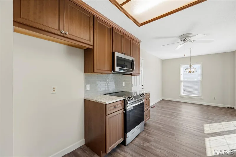 Smooth Top Electric Range and Above the Range Microwave in Kitchen — 3044 Brentmoor Drive, St Charles, MO 63303