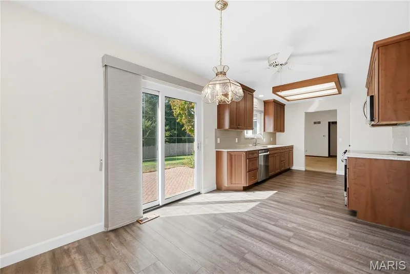 Breakfast Room and Updated Kitchen with Sliding Glass Door opening up to Patio — 3044 Brentmoor Drive, St Charles, MO 63303
