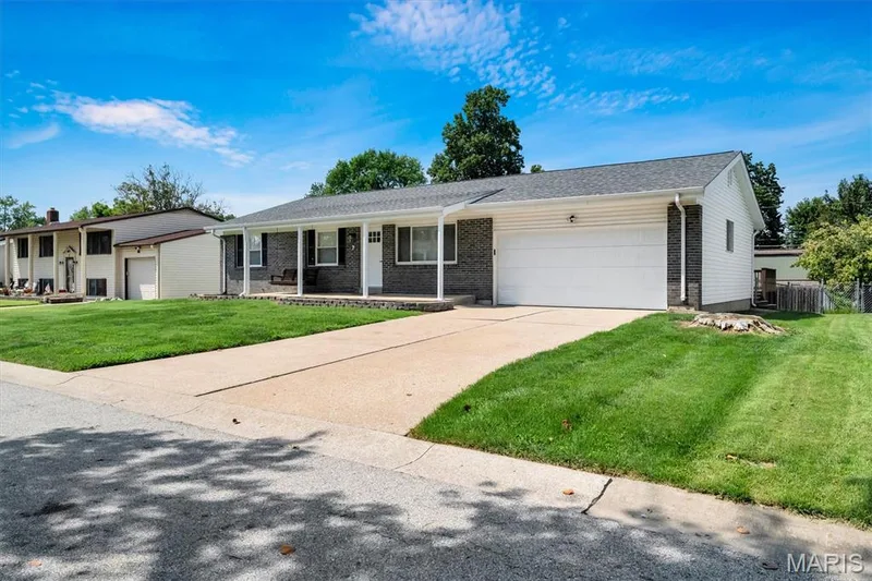 Brick facade with white siding accents — 7 Saint Mark Drive, St Peters, MO 63376
