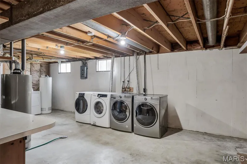Concrete flooring with exposed ceiling joists — 7 Saint Mark Drive, St Peters, MO 63376