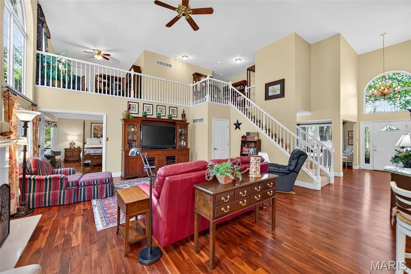 Rich hardwood flooring throughout most of the main level — 730 Longfellow Circle, O'Fallon, MO 63366