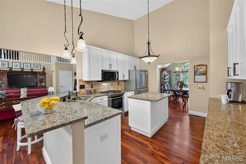 Beautiful updated kitchen with breakfast bar — 730 Longfellow Circle, O'Fallon, MO 63366
