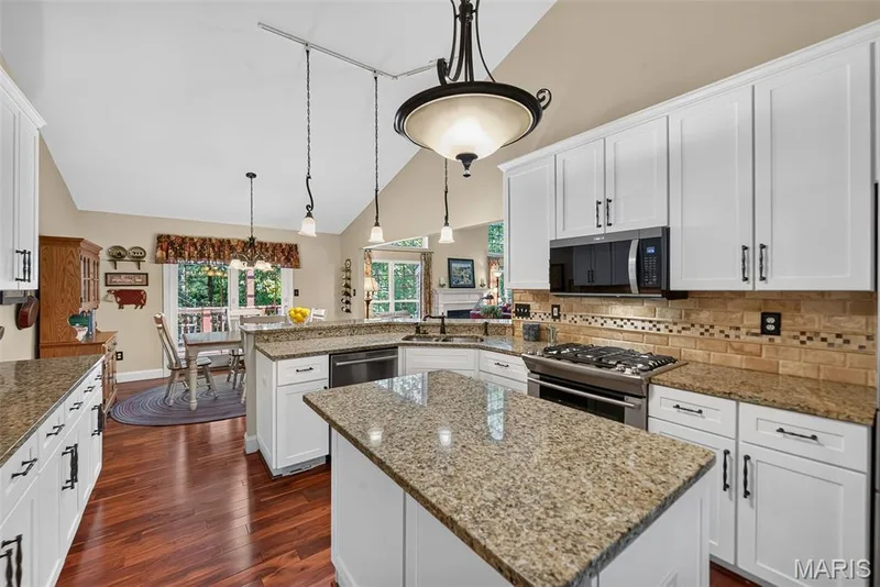 Granite countertops and center island — 730 Longfellow Circle, O'Fallon, MO 63366