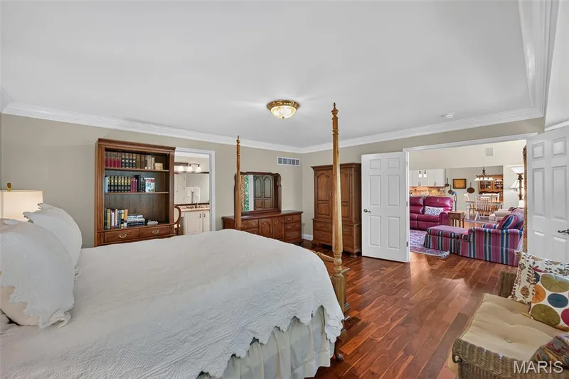 French doors lead into the main floor primary suite — 730 Longfellow Circle, O'Fallon, MO 63366