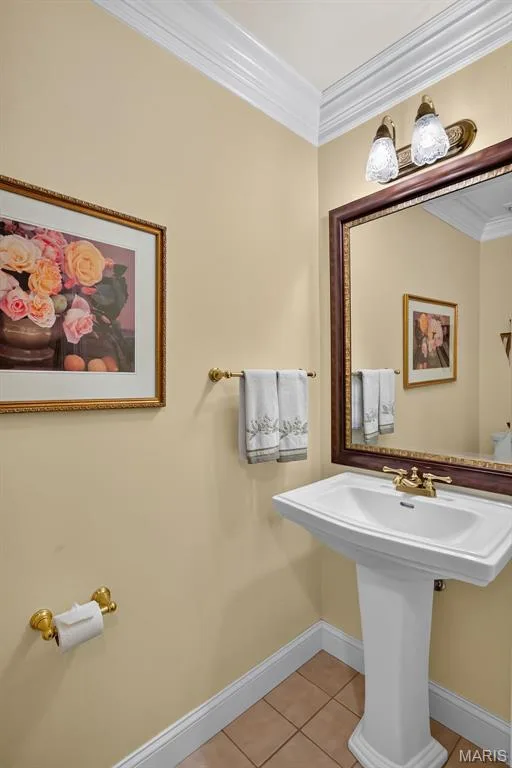 Main floor powder room with pedestal sink and crown molding — 730 Longfellow Circle, O'Fallon, MO 63366