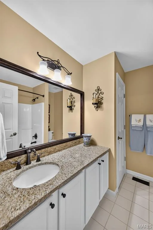 Updated bathroom with granite counters — 730 Longfellow Circle, O'Fallon, MO 63366