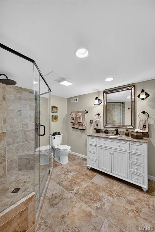 Beautifully finished bathroom with tiled shower — 730 Longfellow Circle, O'Fallon, MO 63366