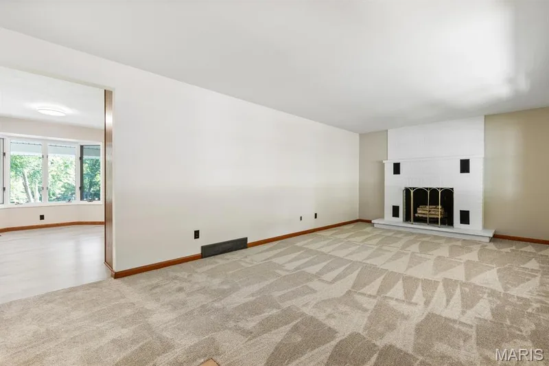 Living room with decorative fireplace — 14 Connie Drive, St Charles, MO 63301