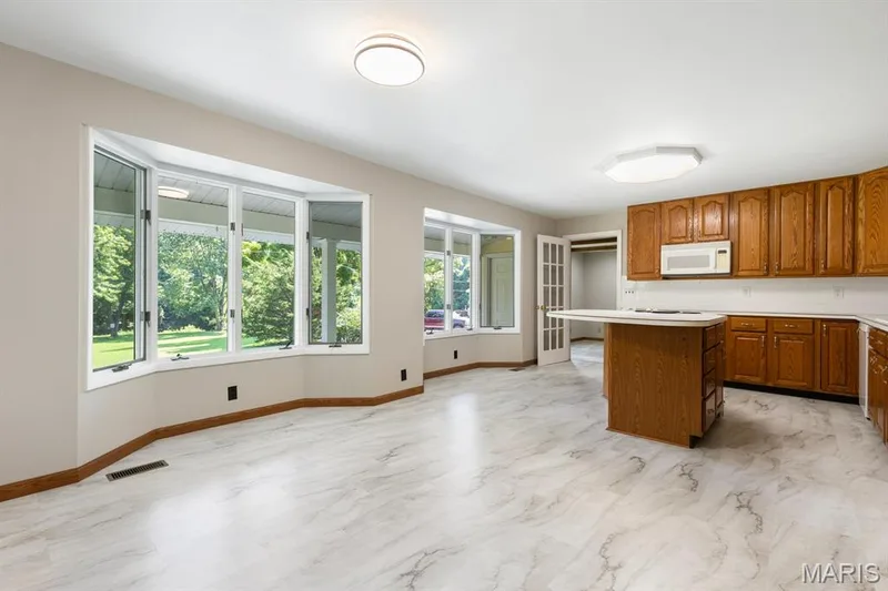 Tons of natural light in kitchen & breakfast room with two bay windows — 14 Connie Drive, St Charles, MO 63301