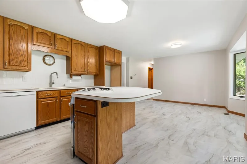 Breakfast bar, Bosch dishwasher, newer lighting — 14 Connie Drive, St Charles, MO 63301