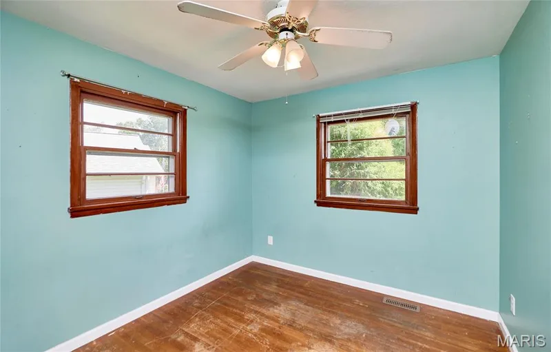 Wood-finish flooring with white trim — 318 Capri Drive, O'Fallon, MO 63366