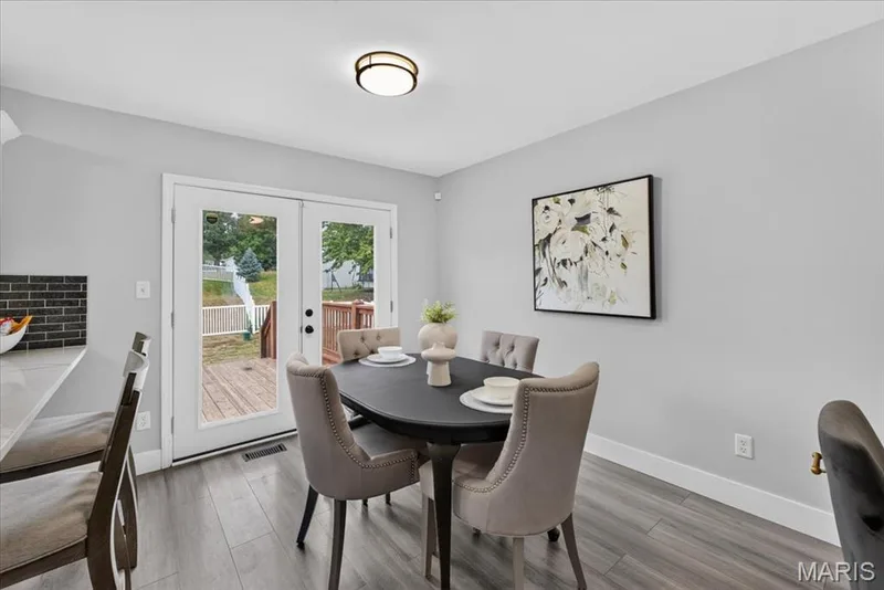 Wood-finish flooring, white trim, and light gray walls — 35 Snowmass Court, O'Fallon, MO 63368
