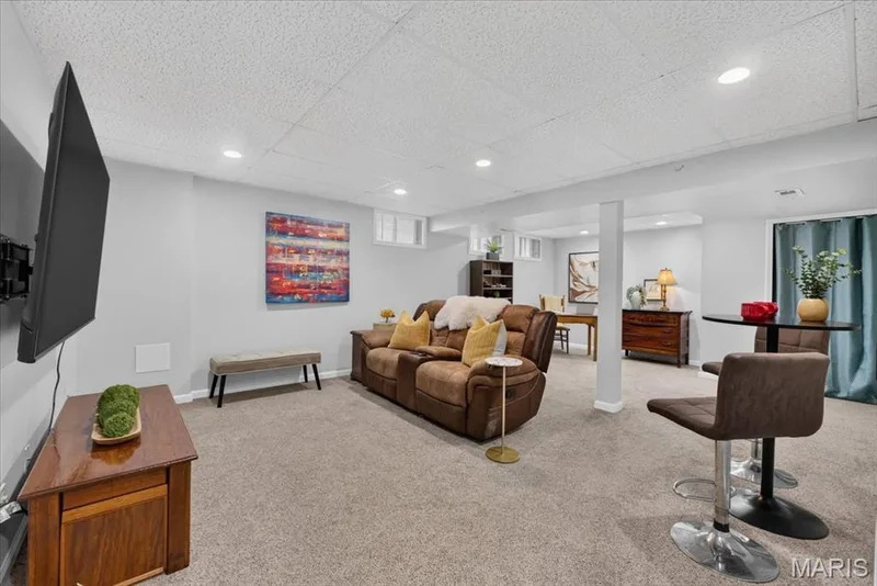 Recessed lighting illuminates the carpeted floor — 35 Snowmass Court, O'Fallon, MO 63368
