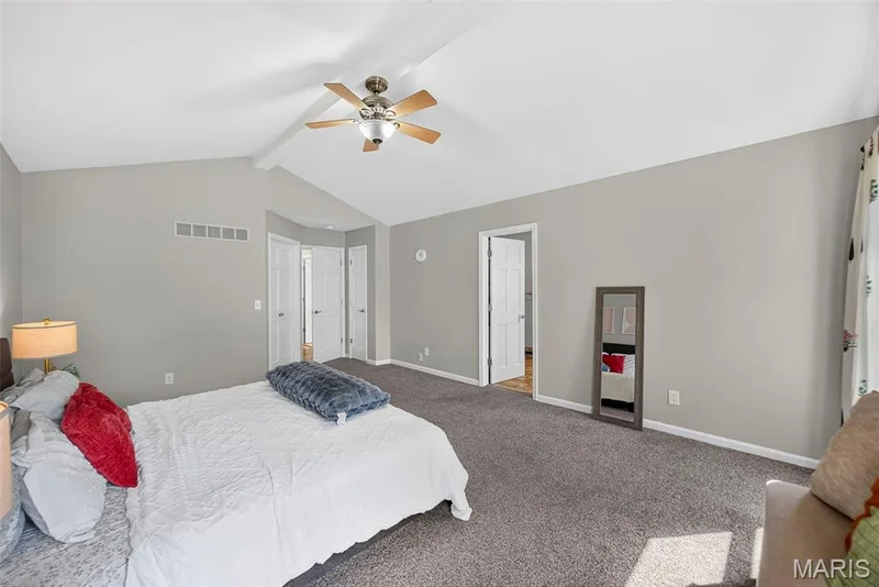 High ceiling primary bedroom with french door to closet — 6 Potomac Court, St Charles, MO 63303