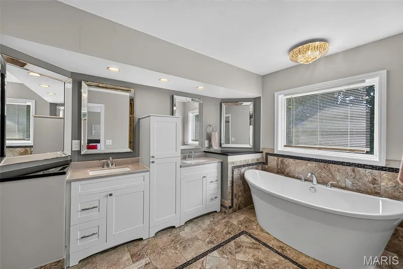 Primary bathroom with double vanity — 6 Potomac Court, St Charles, MO 63303