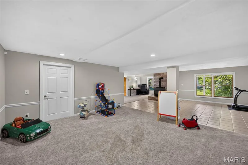 Carpeted area in finished basement — 6 Potomac Court, St Charles, MO 63303