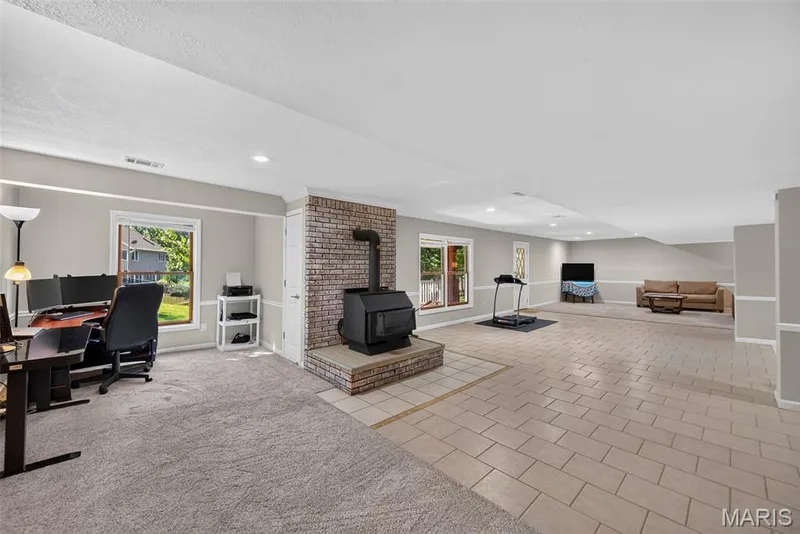 Wood burning stove in walkout basement — 6 Potomac Court, St Charles, MO 63303