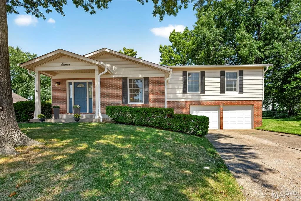 Charming Multi Level Home with Brick, Vinyl Siding, Covered Front Porch and Oversized Two Car Garage — 16 Mill Race Drive, St Peters, MO 63376