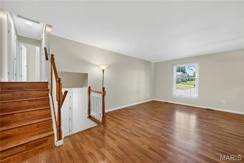 Main Floor Family Room with Laminate Flooring — 16 Mill Race Drive, St Peters, MO 63376
