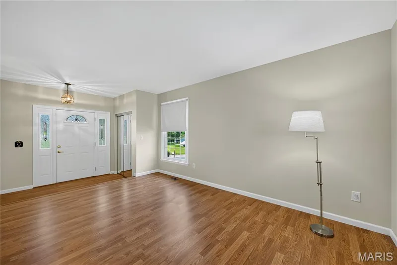 Dining Room and Entry Foyer with Laminate Flooring — 16 Mill Race Drive, St Peters, MO 63376