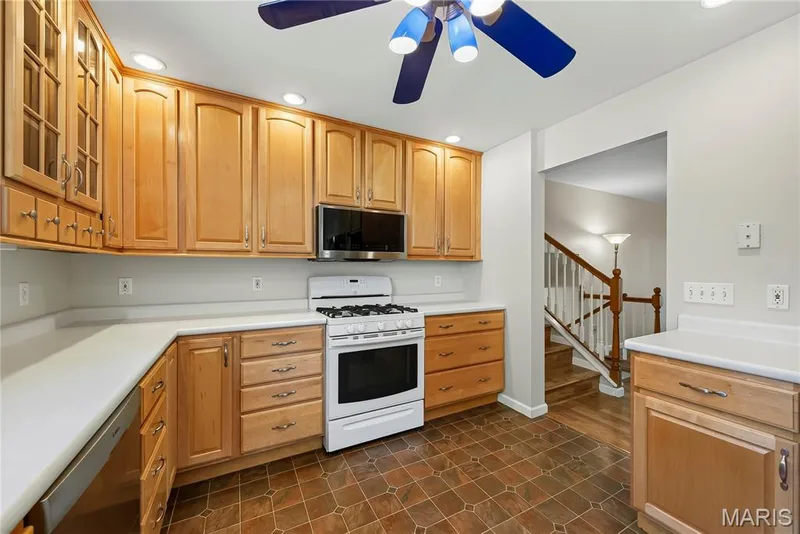 Gas Range and Above the Range Microwave in Kitchen — 16 Mill Race Drive, St Peters, MO 63376
