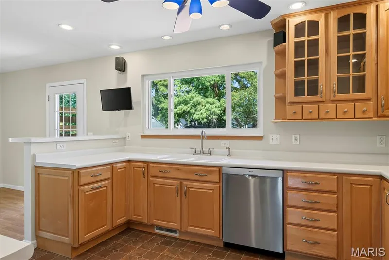 42 inch Wood Cabinets with Display Cabinet in Kitchen — 16 Mill Race Drive, St Peters, MO 63376