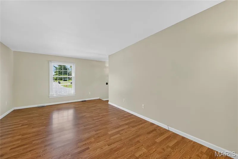 Main Floor Family Room with Laminate Flooring — 16 Mill Race Drive, St Peters, MO 63376