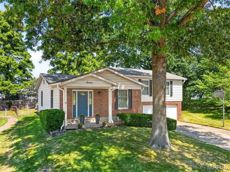 Covered Front Porch Shaded by Mature Trees — 16 Mill Race Drive, St Peters, MO 63376