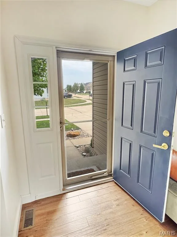 Wood-finish flooring in an entry — 4024 Glengarry Drive, Wentzville, MO 63385