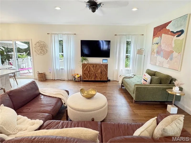 Wood-finish flooring throughout, recessed lighting, and a ceiling fan — 4024 Glengarry Drive, Wentzville, MO 63385