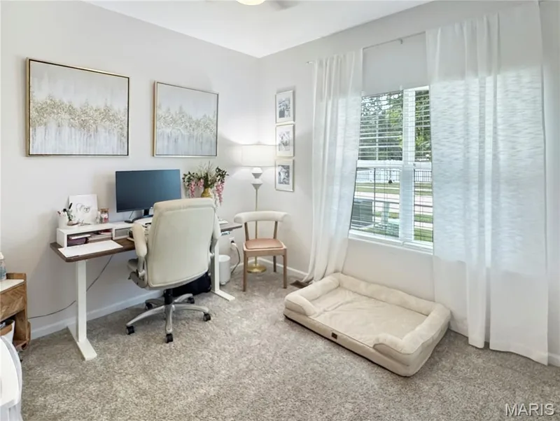 Wall-to-wall carpeting and a window with blinds and sheer drapes — 4024 Glengarry Drive, Wentzville, MO 63385