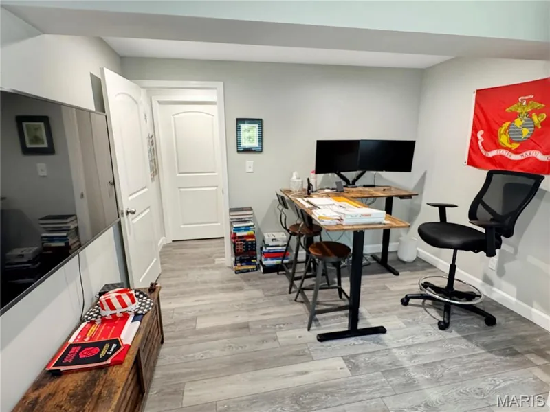 Light gray wall paint, LVP flooring, white interior doors, and a built-in wall niche — 4024 Glengarry Drive, Wentzville, MO 63385