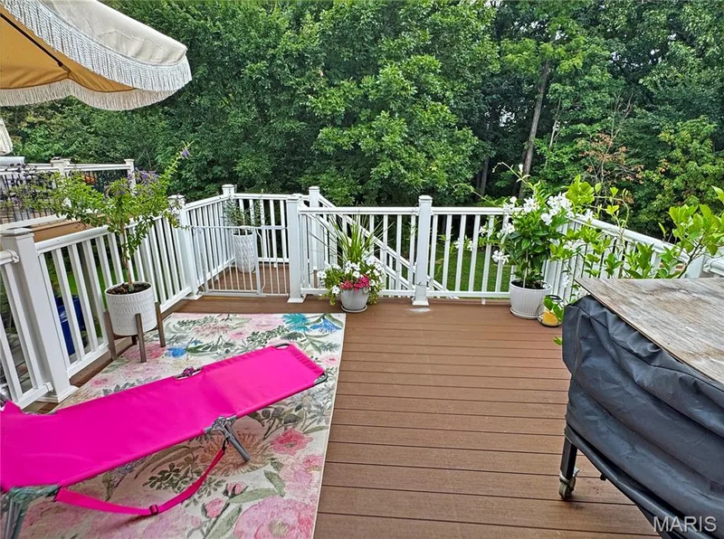 Wood-finish deck with white railings and gate — 4024 Glengarry Drive, Wentzville, MO 63385