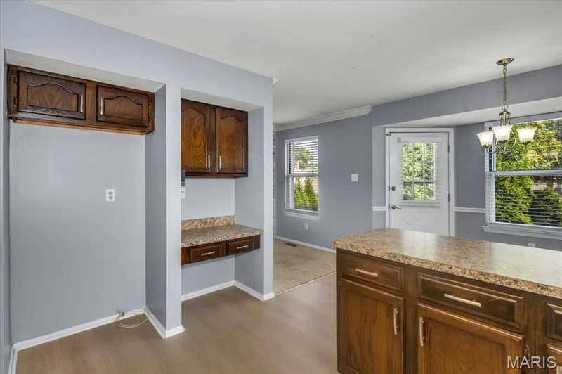 Refrigerator space and planning desk with cabinets. — 1346 Cherry Glen Court, Chesterfield, MO 63017