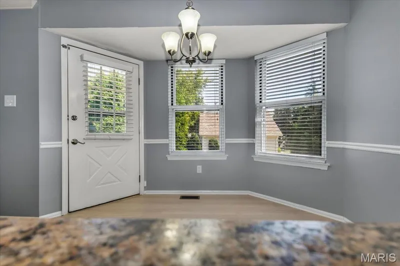 Door to backyard and patio from the breakfast room Breakfast bar. — 1346 Cherry Glen Court, Chesterfield, MO 63017
