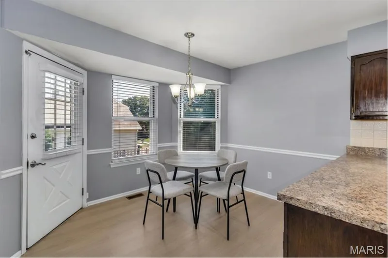 Virtually staged breakfast area. Door to backyard and  patio — 1346 Cherry Glen Court, Chesterfield, MO 63017