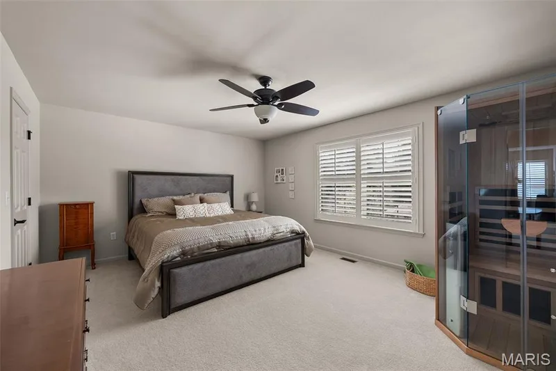 Recessed lighting, ceiling fan with light fixture, window with plantation shutters, light gray wall paint, and light-colored carpet flooring — 2700 Grover Crossing Drive, Wildwood, MO 63040