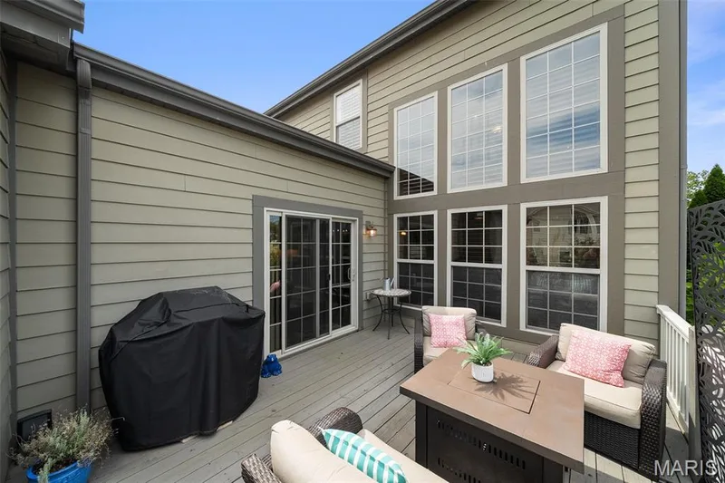 Two-story exterior with horizontal siding and multiple large windows — 2700 Grover Crossing Drive, Wildwood, MO 63040