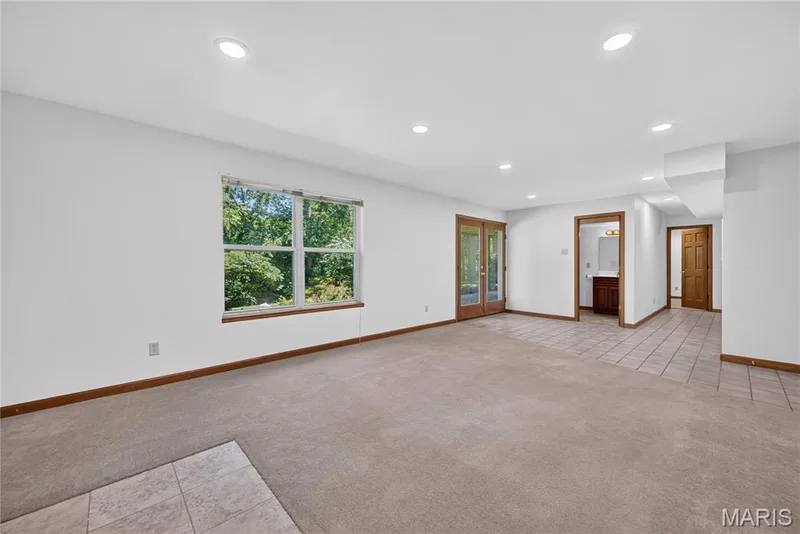 Lower Level Family Room with Walk out to Spacious Backyard — 4 Woodford Place, St Charles, MO 63301