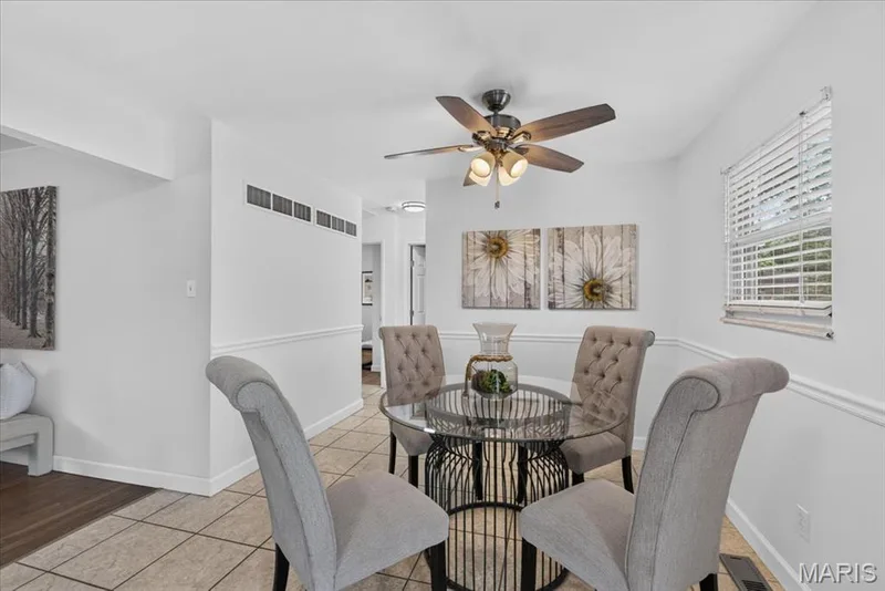 Recessed ceiling lighting, ceiling fan with integrated lighting, tile flooring, window with blinds, and decorative wall molding — 11 Toelle Drive, St Charles, MO 63304