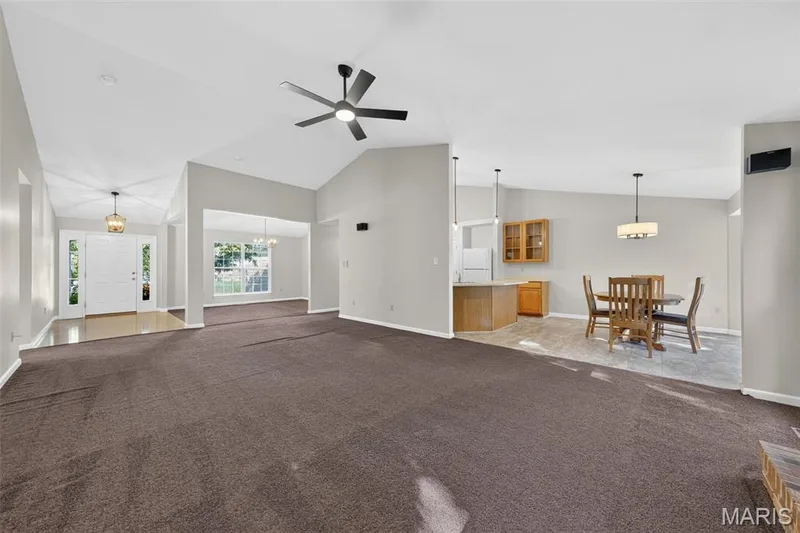 Vaulted ceilings, a contemporary ceiling fan, and a built-in kitchen island — 155 Snake River Drive, Dardenne Prairie, MO 63368